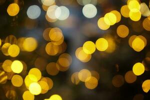 guld ljus bokeh för Semester lampor bakgrund eller jul bakgrund foto