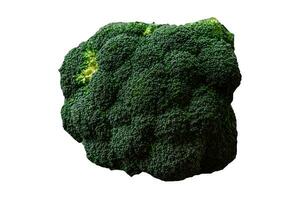 rå färsk broccoli på en svart Hem kök tabell foto