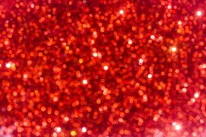röd gnistrande glitter bokeh bakgrund. foto