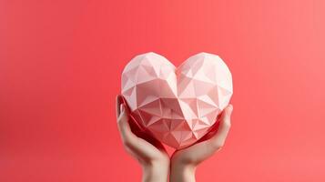 ai genererad Lycklig valentines dag hand innehav rosa papper polygon hjärta, korall Färg bakgrund, Plats för text, kopia Plats, romantisk foto