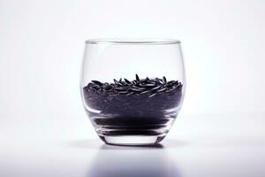 ai genererad en glas skål fylld med svart korn av vild ris på en vit bakgrund. kan vara Begagnade för mat eller hälso relaterat innehåll foto