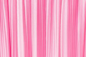 delikat chic textil- bakgrund av rosa Färg. veck av chiffong eller silke tyg. abstrakt bakgrund för design. en kopia Plats foto