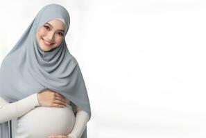 ai genererad asiatisk kvinna i hijab med utgör innehav gravid mage och leende ansiktsbehandling uttryck isolerat vit bakgrund foto