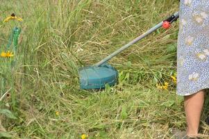 trimmer och dess delar för gräsklippning foto