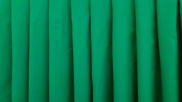 grön textil- textur bakgrund tapet mönster tyg material design modern elegant bakgrund yta Vinka lyx konst modern ljus grunge druvor skön kurva sammet ridå satin grön foto