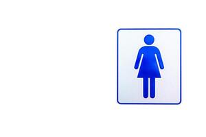 kvinnor toalett symbol på de vit cement vägg och blå Färg för mark foto