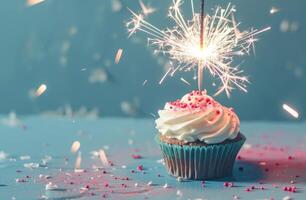 ai genererad glittrande muffin med gnistrande sparkler på en blå bakgrund foto