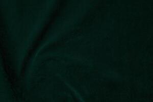 mörk grön sammet tyg textur Begagnade som bakgrund. smaragd- Färg panne tyg bakgrund av mjuk och slät textil- material. krossad sammet .lyx smaragd- tona för silke... foto
