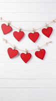ai genererad röd hjärtan på rep med klädnypor på en vit trä- valentine kopia Plats bakgrund foto
