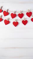 ai genererad röd hjärtan på rep med klädnypor på en vit trä- valentine kopia Plats bakgrund foto