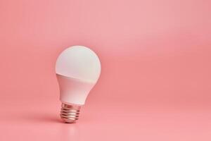 glödlampa, kopieringsutrymme. energibesparing minimal idé concept.pink bakgrund. foto