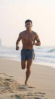ai generativ idrottare löpning man lyssnande till musik på smartphone sportig passa ung man joggning på de strand joggare Träning med smart telefon armbindel foto
