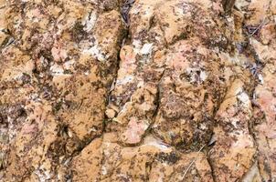 yta av de sten en hål med brun färgton foto