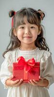 ai genererad liten flicka med glad leende innehav röd gåva låda, Semester firande foto