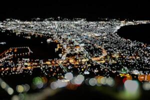 landskap av suddig hakodate bukt område i höst natt från montera hakodate med skön bokde bakgrund. foto