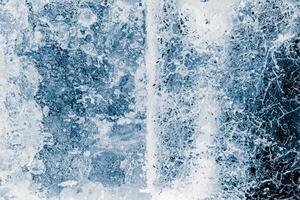 is block yta, blå tonad. is textur bakgrund. texturerad kall frostig yta av is block. foto