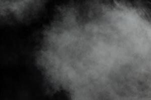 abstrakt vitt pulver explosion på en svart background.freeze rörelse av vitt pulver stänk. foto
