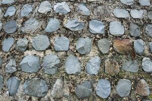 staplade stenar textur, detaljerad textur av en sten fundament stödjande singel sidospår foto