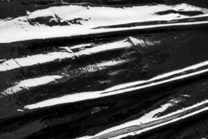 svart transparent plast filma slå in täcka över textur bakgrund foto