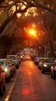 ai genererad solnedgång glöd över en trädkantade gata med parkerad bilar foto