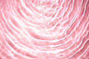 skön vatten textur med vågor. rosa Färg, vatten bakgrund foto
