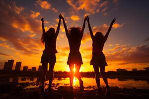 ai genererad silhuett av tre vänner Hoppar. tre kvinnor stående i främre av en solnedgång med deras vapen i de luft foto