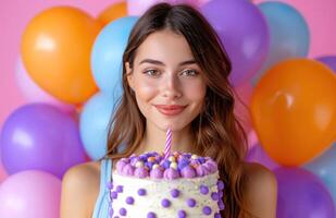 ai genererad Lycklig ung kvinna innehav födelsedag kaka med färgrik ballonger. foto