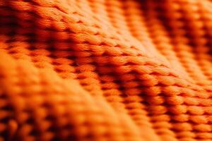 ai genererad stickat ljus orange Tröja tyg. tyg textur med stor slingor. skön texturerad bakgrund. foto