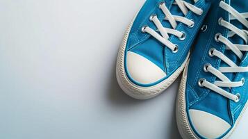 ai genererad blå duk skor isolerat på platt vit bakgrund med kopia Plats för annons. generativ ai foto