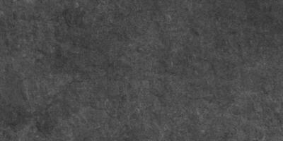 stänga upp av mörk grafit eller betong yta textur, mörk svart grunge texturerad svarta tavlan eller svarta tavlan, svartvit skiffer grunge betong vägg eller plåster, bedrövad täcka över betong textur. foto