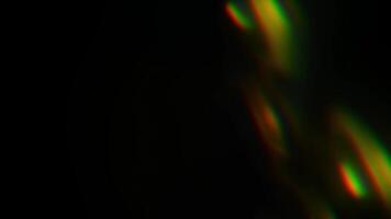 regnbågsskimrande slingor på en svart bakgrund. till täcka över och skapa en ljus, solig och intressant bild foto