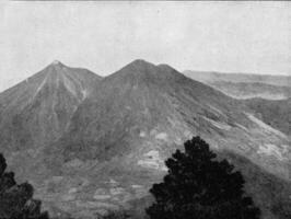 de tvilling vulkaner fuego och acatenango i guatemala, årgång gravyr. foto