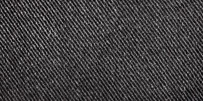 svart denim tyg makro Foto. jeans som en bakgrund. tyg textur. foto