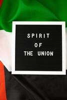 text anda av de union på bakgrund flagga av uae. nationell Semester av förenad arab emiraten. åminnelse dag muslim arab högtider. dubai firande foto