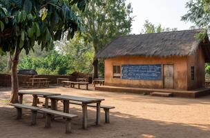 ai genererad lantlig afrikansk skolhus med utomhus- bänkar foto