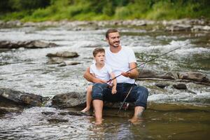 far och son tillsammans fiske foto