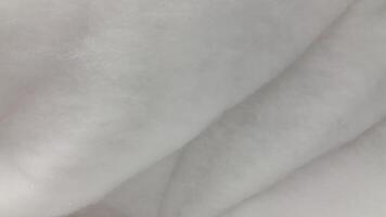 fluffig textur. mjuk vit fluffig yta. suddig bakgrund foto