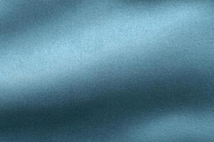 en närbild av en bakgrund med en textur av blå tyg. foto