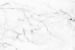 hög upplösning vit marmor textur och bakgrund erbjudande en lyxig dekorativ design mönster för konstverk. de marmor utsökt kvalitet lägger till till dess överklagande. foto