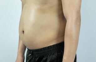 män med pott magar eller mage fett. närbild av kropp delar foto