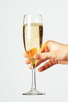 ai genererad hand innehav en glas av gnistrande champagne mot en vit bakgrund foto