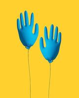 rengöring begrepp. handskar för rengöring i de form av ett uppblåsbar boll på en gul bakgrund. kreativ aning. foto