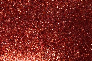 festlig röd gnistrande lampor bakgrund med abstrakt jul bokeh och faller stjärnor, perfekt för vinter- kort eller inbjudningar foto