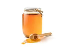 glasburk ren honung med honungsbock isolerad på vit bakgrund foto