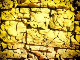 textur av gul sten i de trädgård foto