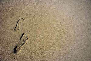 mänsklig fotspår i de sand foto