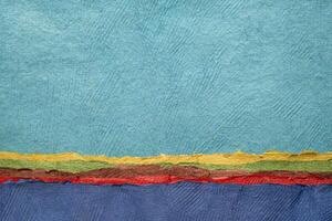abstrakt landskap med en blå himmel och hav - en samling av handgjort texturerad konst papper foto