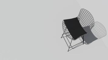 en vit stol med en svart prydnadskudde sitter på en vit vägg foto