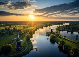 ai genererad antenn se av flod och väderkvarnar på solnedgång foto