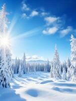 en snöig landskap med träd och blå himmel foto